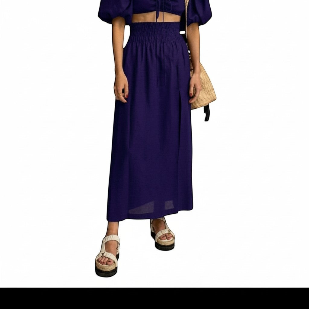 REVES falda maxi azul marino de cintura alta con abertura frontal y banda elástica, ideal para verano.