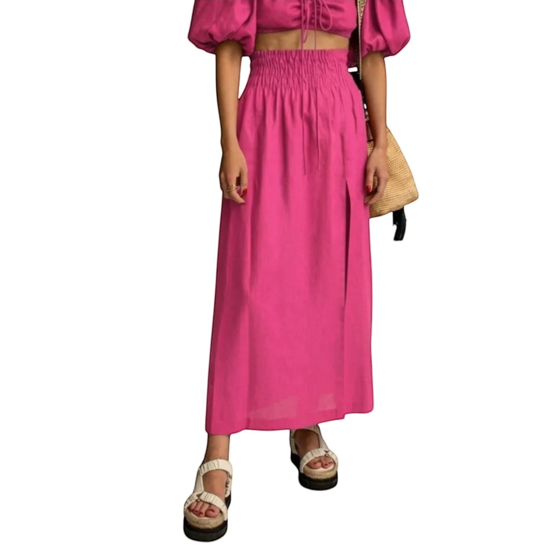 Falda maxi fucsia de REVES con cintura alta elástica y abertura frontal. Tejido ligero.